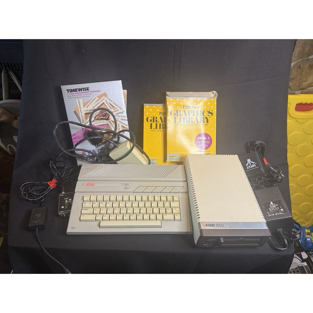 Atari 130 XE/Atari 1050 Bundle W/ Cords And Extras (Powered On)